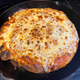 The completed pizza, straight from the broiler